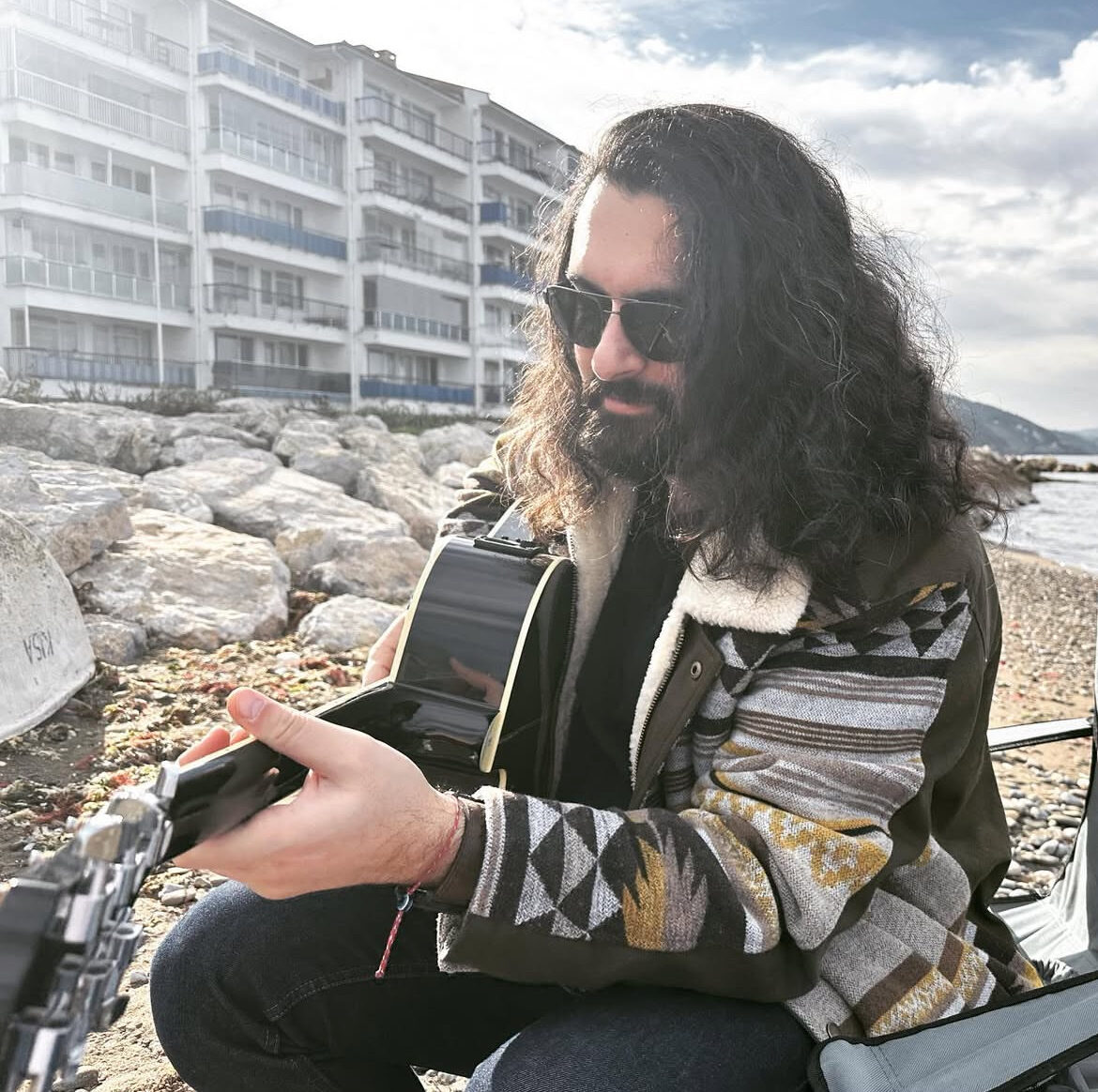 Ali playing guitar